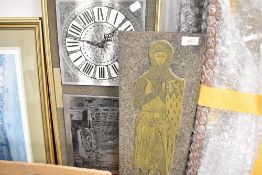 A wall clock and a vintage knight plaque