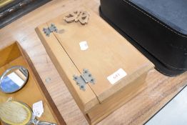 A pine trinket case with butterfly decoration