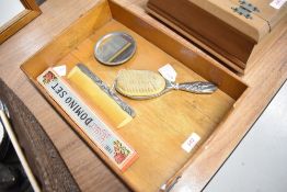 A polished metal dressing table set along with Dominoes and letter rack
