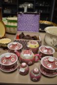 A cased Chinese Zisha tea set and similar Cantonese styled set
