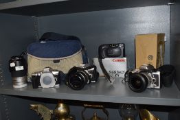A selection of cameras including Minolta and Canon, also a Minolta hoya 55mm skylight (1B) lens.