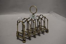 An early Victorian silver plated concertina toast rack.