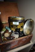 A selection of curios and trinkets in wooden case including watches enamel badges and buttons