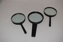 Three magnifying glasses.