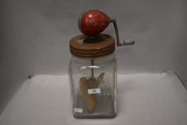A vintage blow butter churn.