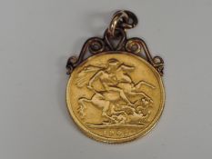 A United Kingdom Edward VII 1902 Gold Sovereign, no mint mark, having fixed yellow metal mount