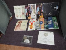 A collection of GB Royal Mint Uncirculated and Brilliant Uncirculated £5, £2, £1 and 50p Coins along