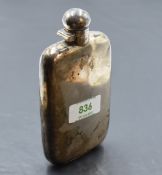 An Edwardian silver hip flask, of rounded rectangular form, curved for the gentleman's pocket, marks