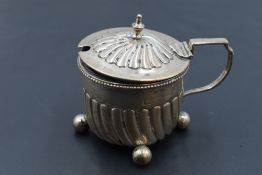 A Victorian silver mustard, of circular form with spiral gadrooning to the domed cover and body,