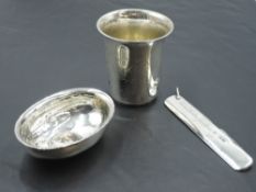 A small Victorian white metal beaker having dated monogram to front and bearing mark, possibly