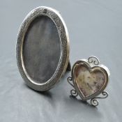 A small Victorian silver photograph frame of heart form having wire decoration and silver easel
