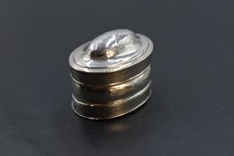 A Georgian silver nutmeg grater of domed oval form with brightcut engraving, steel grater and