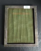 A silver rectangular photograph frame of plain form having wooden easel stand, Birmingham 1922,