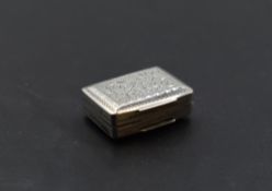 A small Georgian silver vinaigrette having engraved foliate and acorn decoration with gilt