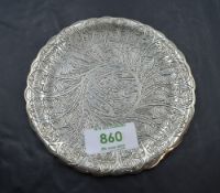 An Egyptian silver bottle saucer having extensive engraved decoration and shaped rim, approx 68.7g