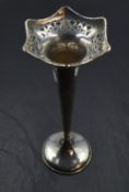 A silver trumpet vase having pierced decoration to shaped rim, tapered stem and weighted base,