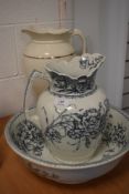 A wash jug and bowl set by Maple and Co with a similar water jug