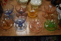 A set of art deco design sundae dishes in a harlequin colour way