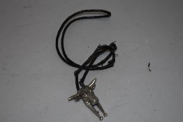 A Texas style shirt tie toggle having leather strap with bulls head fitment