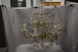 A vintage six branch candelabra having cut glass frame with lustre droplets