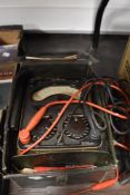 A vintage electric test Avometer in leather case
