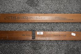 Two vintage Avecta trouser press in pitch pine with printed advertisment