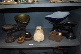 Two sets of vintage kitchen balance scales with weights and foot warmer