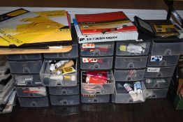 A large collection of art supplies including sketch books, paints and accessories
