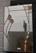 A modern hall way mirror having a Mackintosh style leaded light design