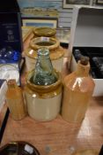 A selection of earthen ware pots and utensil containers with ink bottles