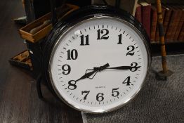 A large sized wall clock in a traditional design