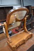 A Victorian satinwood toilet mirror having double drawer base