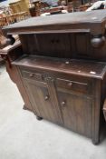 A mid 20th Century oak court cupboard of small proportions, width approx. 91cm