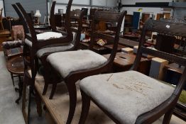 A set of four regency mahogany dining chairs, with carved tablet form top rails over a moulded mid