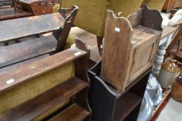 A small three tier wall shelf, with pegged construction, a small oak waall cabinet and an oak two