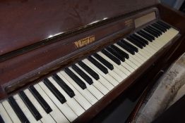An Eavestaff Pianette mini piano and stool