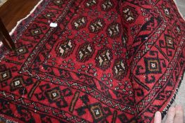 A Persian style rug/runner.