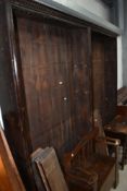 A stained pine double full height library bookshelf