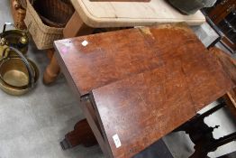 A Victorian mahogany rise and fall, adjustable music stand with two hinged platforms over the square