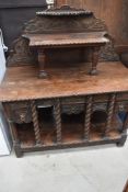 A carved and moulded oak sideboard, an adaptation using old and new timbers, extensively ,carved and