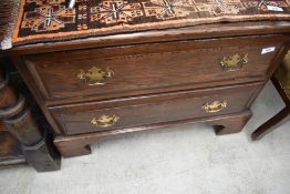 A reproduction oak (titchmarsh and goodwin or similar quality) TV cabinet, on castors
