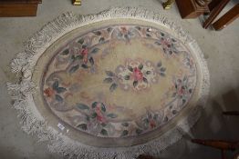 A chinese style oval fireside rug