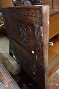 A period oak carved wall panel