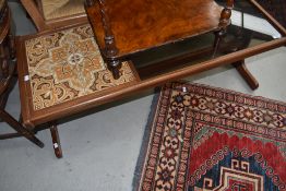 A 1970's tile and glass topped teak coffee table