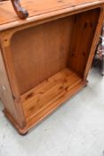 A modern pine open bookcase with two adjustable shelves