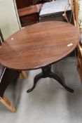 A 19th Century oak pedestal table having circular top, turned column and triple splay legs