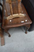 A reproduction mahogany coffee table with glass inset top, cabriole type legs