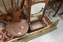 A Wanderwood Arts and Crafts elm three legged stool, with label to underside, damage to one leg,