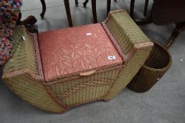 An art deco Lloyd loom style dressing table seat with storage sold with a similar waste paper