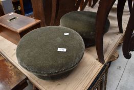 A pair of mushroom style footstools having bun feet and dralon upholstery